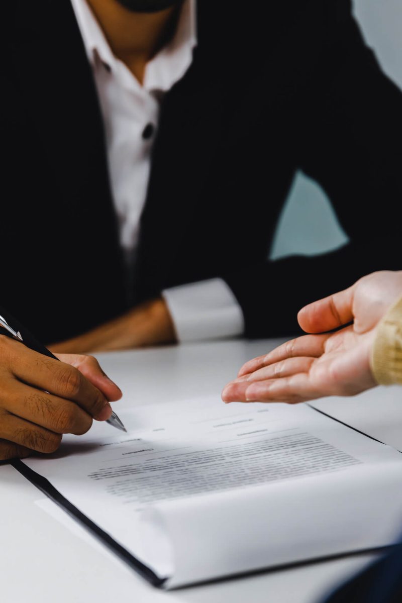 close-up-hand-of-businessman-sign-contract-and-fem-2022-11-23-19-07-38-utc